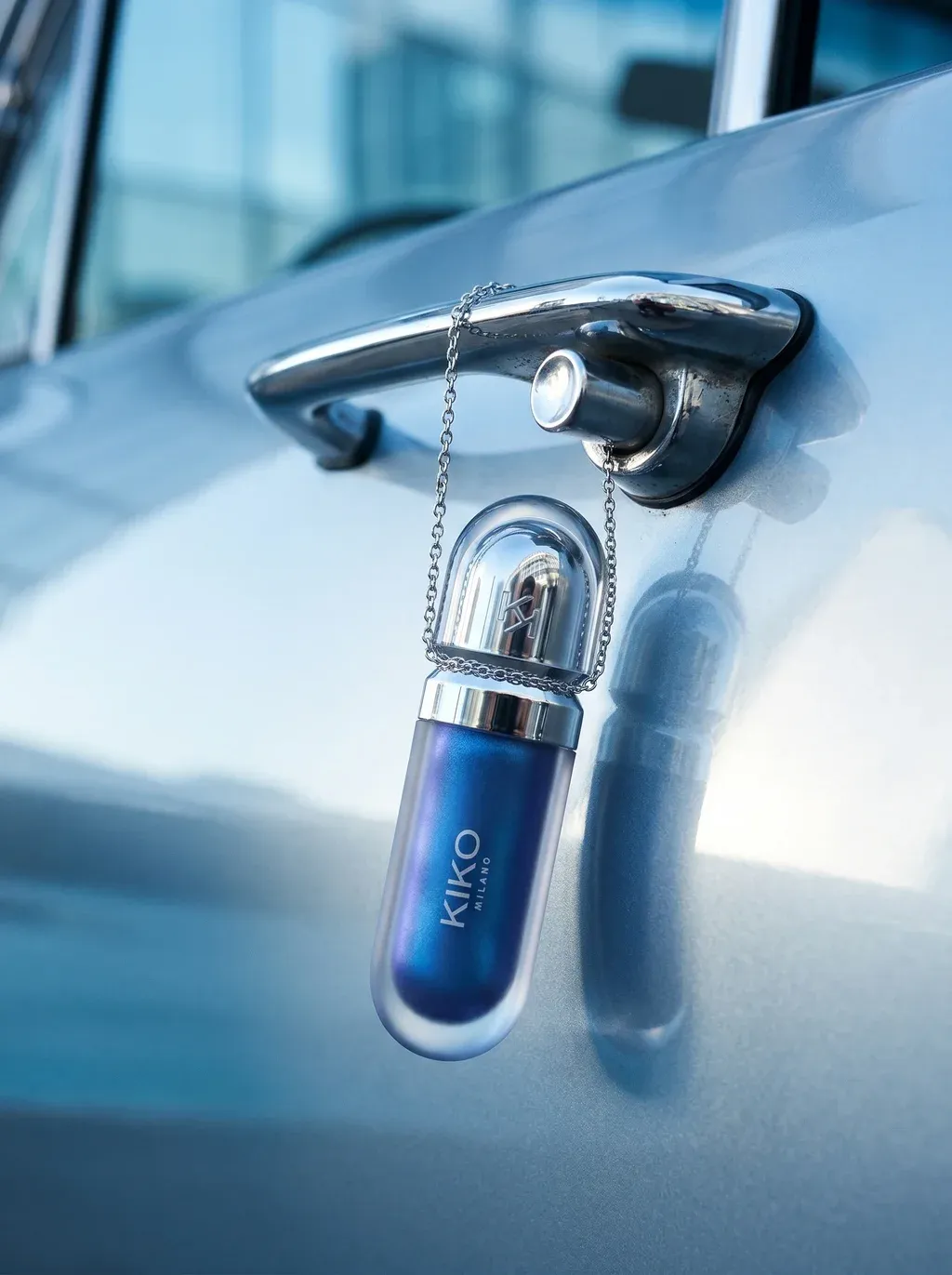 ATTACHED PRODUCT elegantly suspended from the chrome handle of a