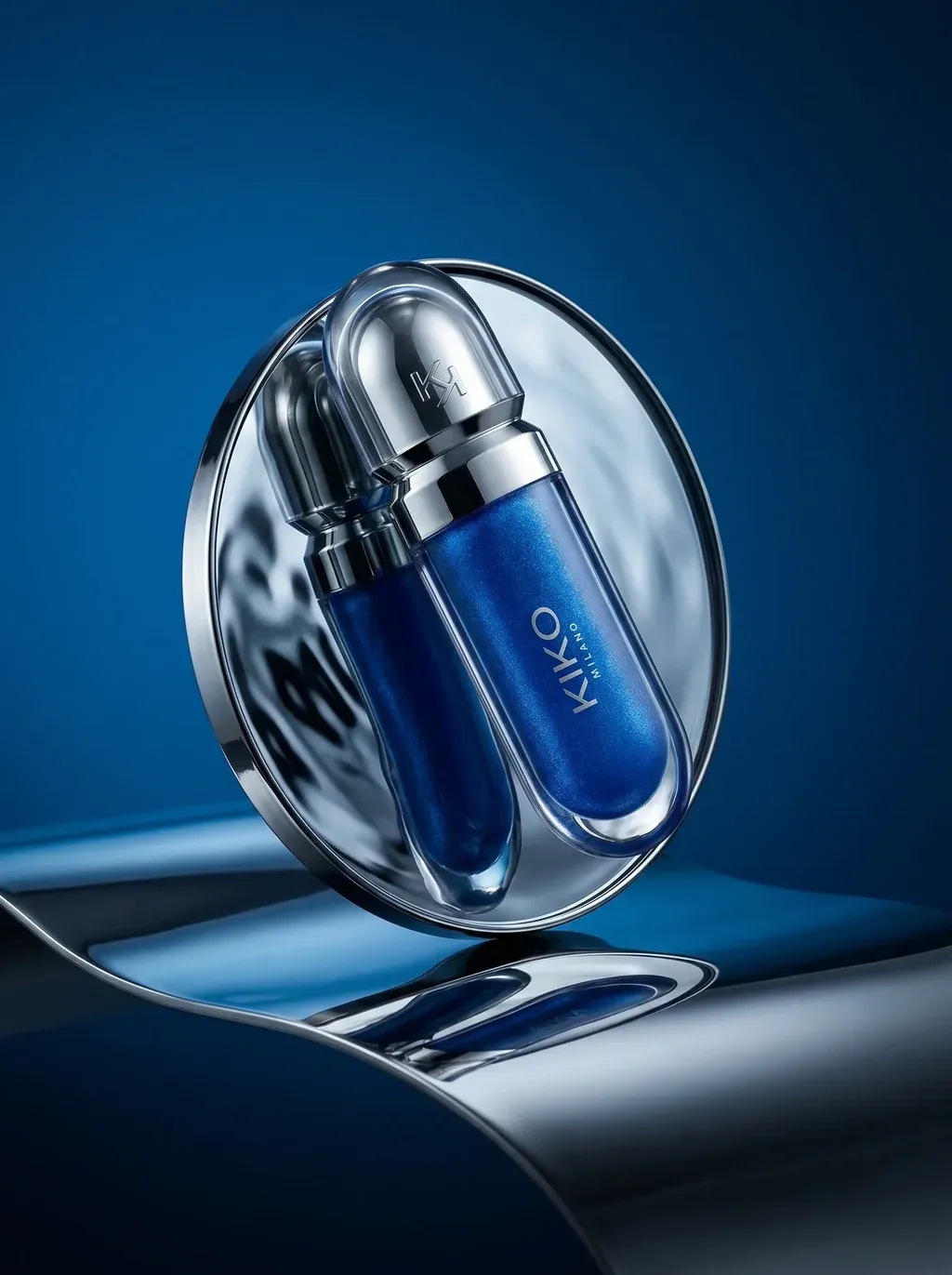 ATTACHED PRODUCT balancing against a circular chrome mirror on a