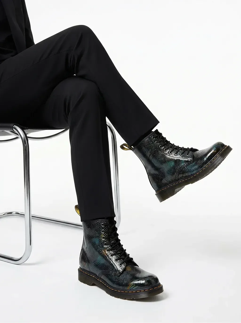 Editorial fashion photography of a model in tailored sleek black