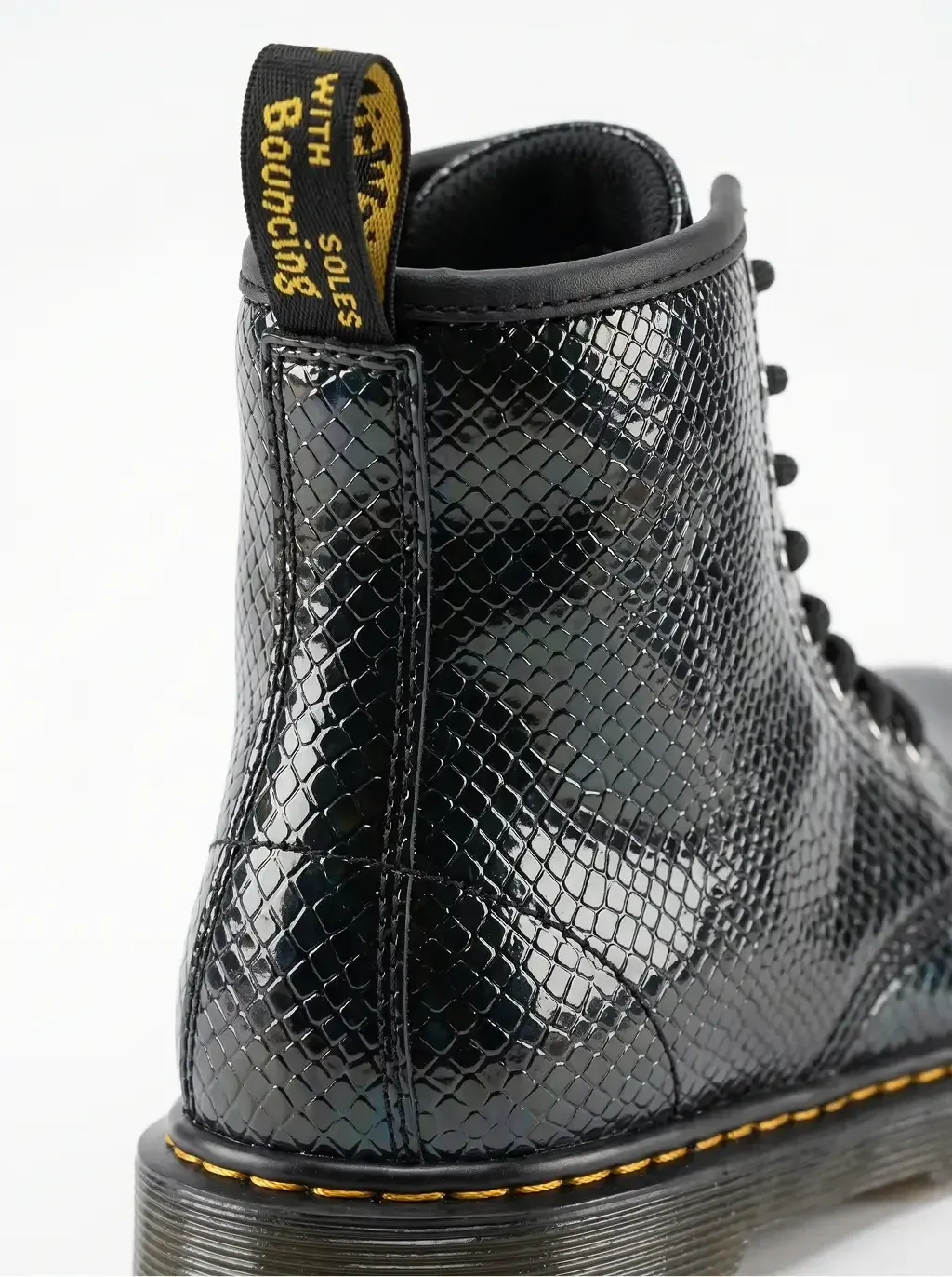 Back-angle close-up product photography of a single 8-eyelet lace-up combat