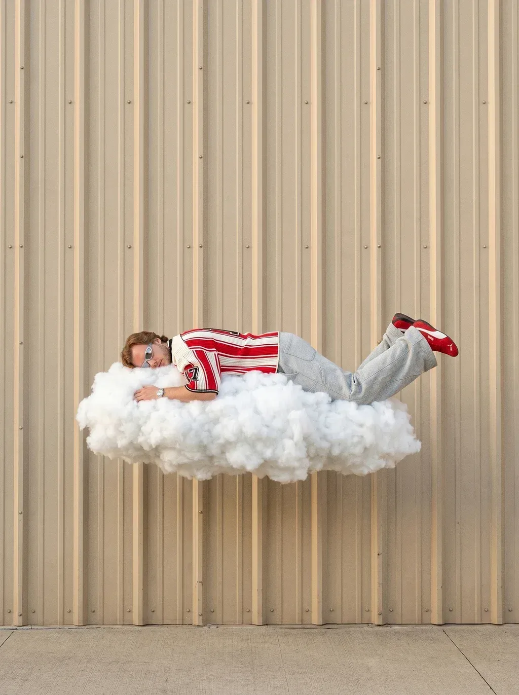 Surreal documentary photography of a young man with reddish-blond hair