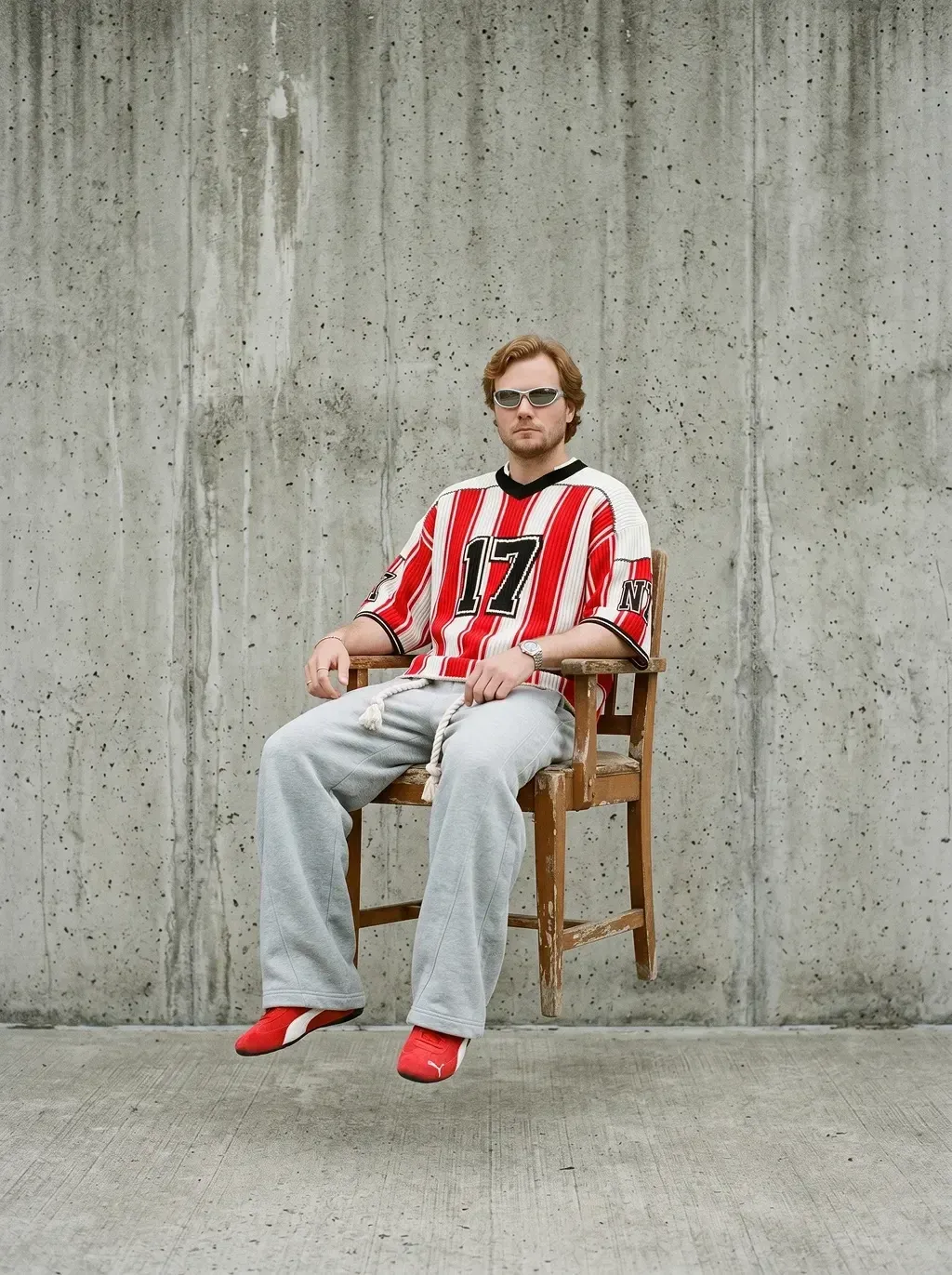 Surreal documentary photography of a young man with reddish-blond hair