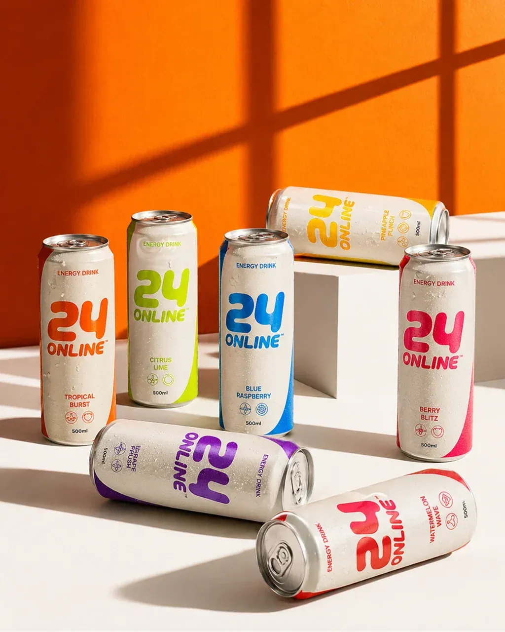 Studio product photography of seven INSERT PRODUCT REFERENCE energy drink