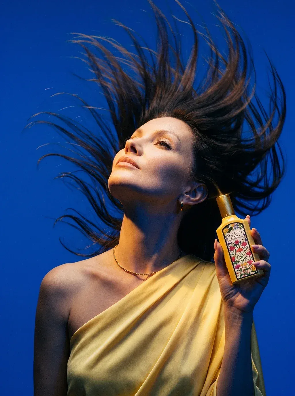 Editorial fragrance campaign close-up portrait of a woman with long