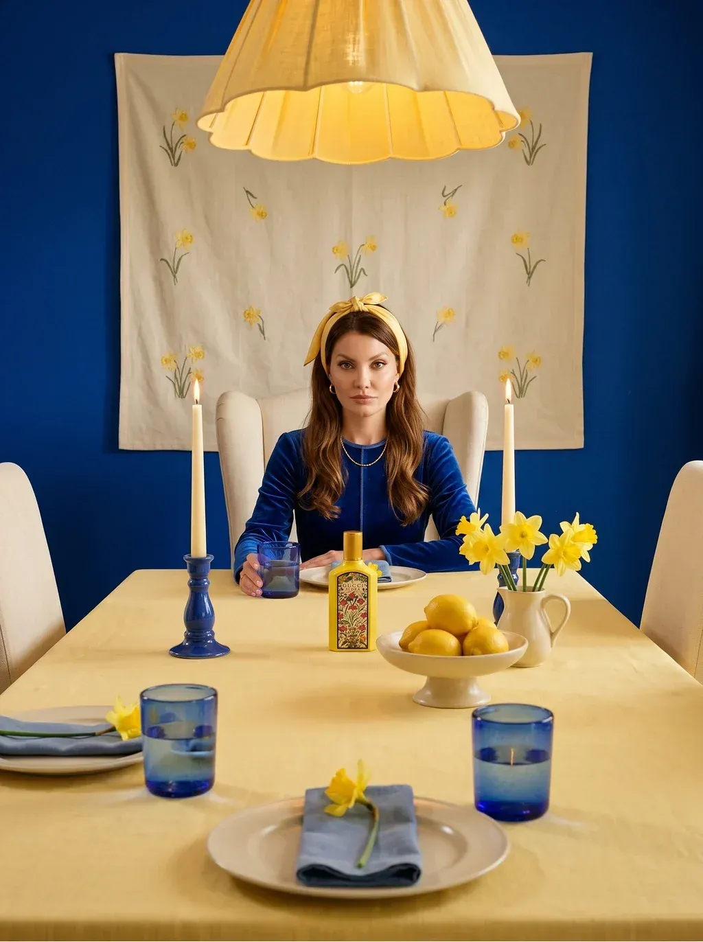 Symmetrical editorial campaign photograph of a woman with long auburn