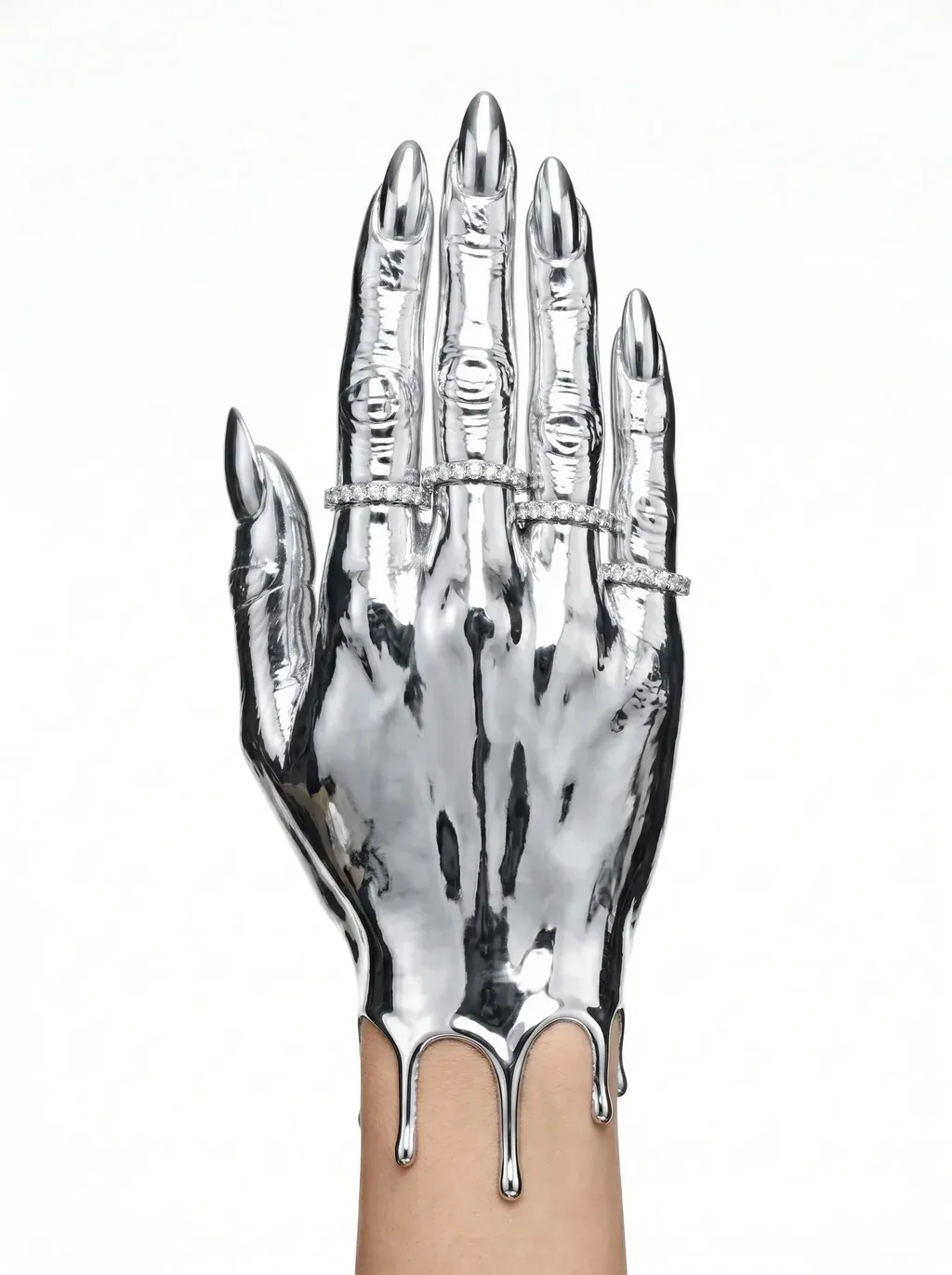 A high-fashion jewelry editorial photograph of a hand and forearm