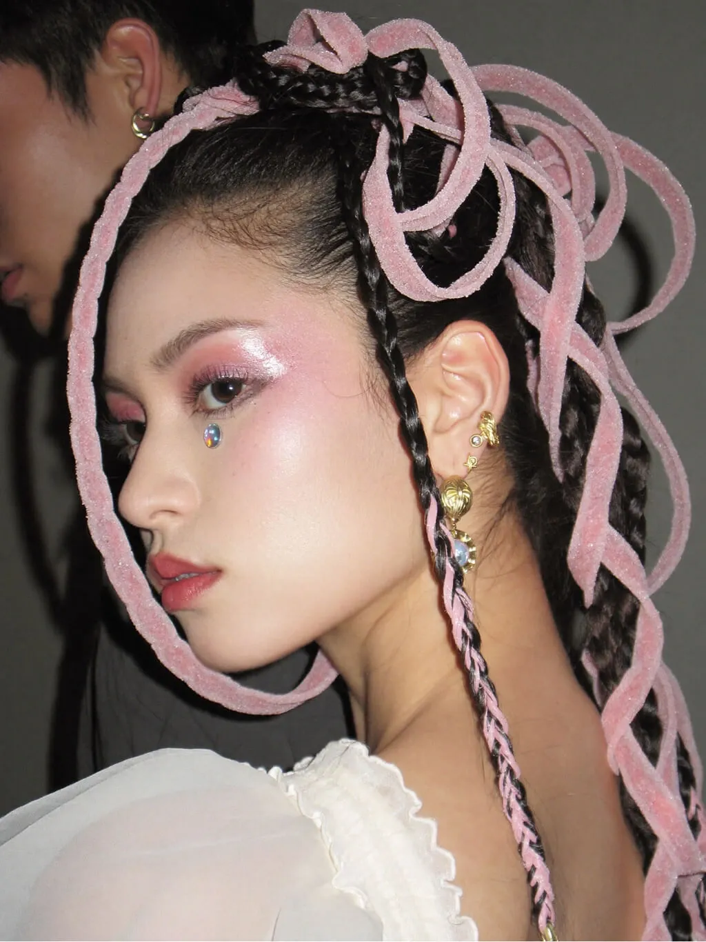A fashion editorial close-up portrait of a young Asian woman