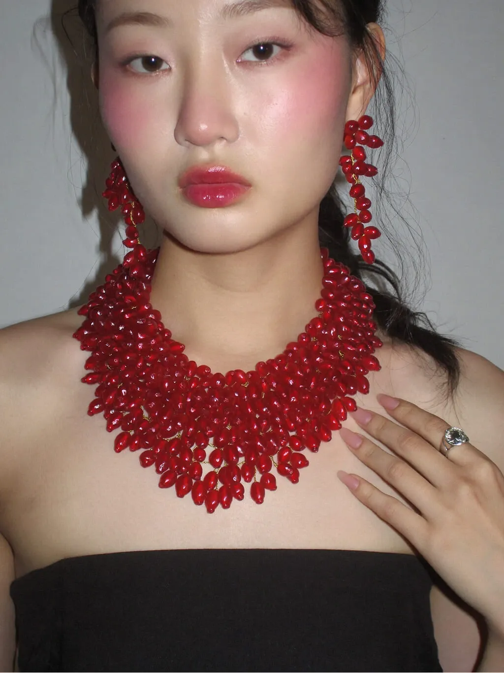 A fashion editorial portrait of a young Asian woman with
