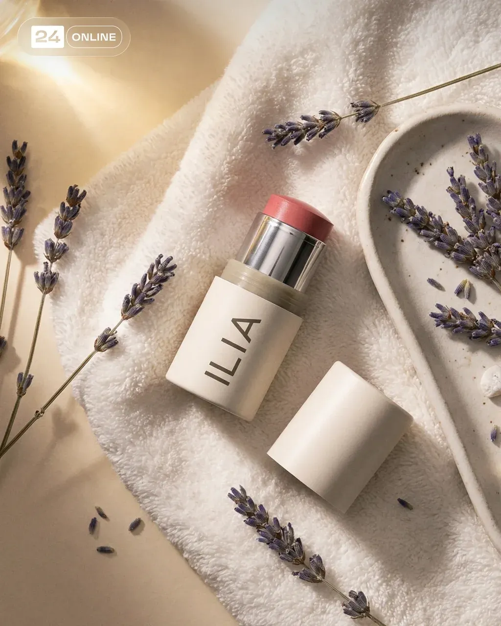 Flat lay product photography of a cream-colored cosmetic blush stick,