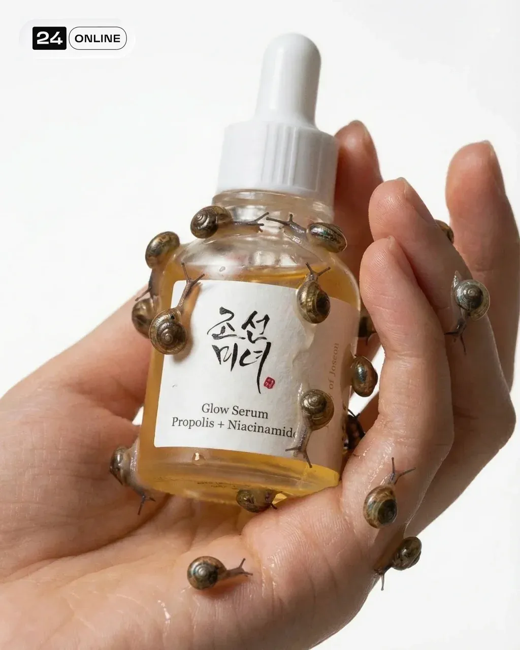 A hand holding a high-end 10ml serum bottle featuring only