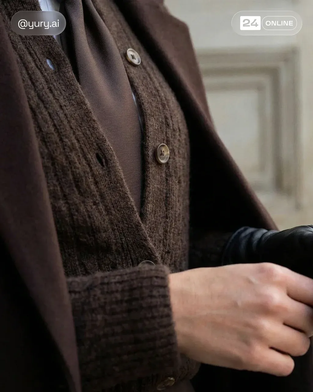 Editorial fashion detail shot of layered brown textures: wool overcoat,