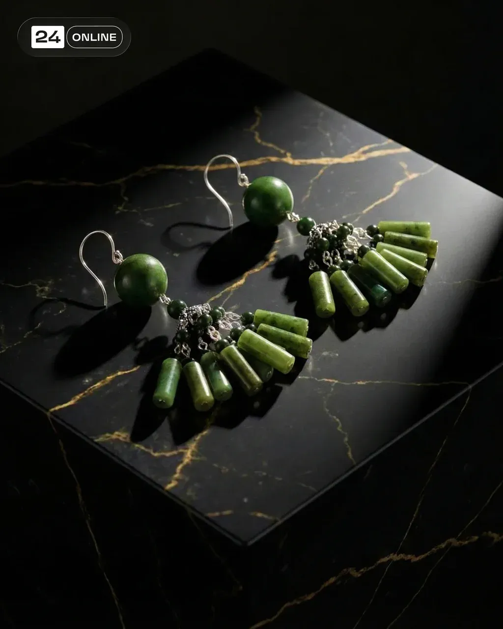 Hyper-realistic product photo of two green jade fan earrings with