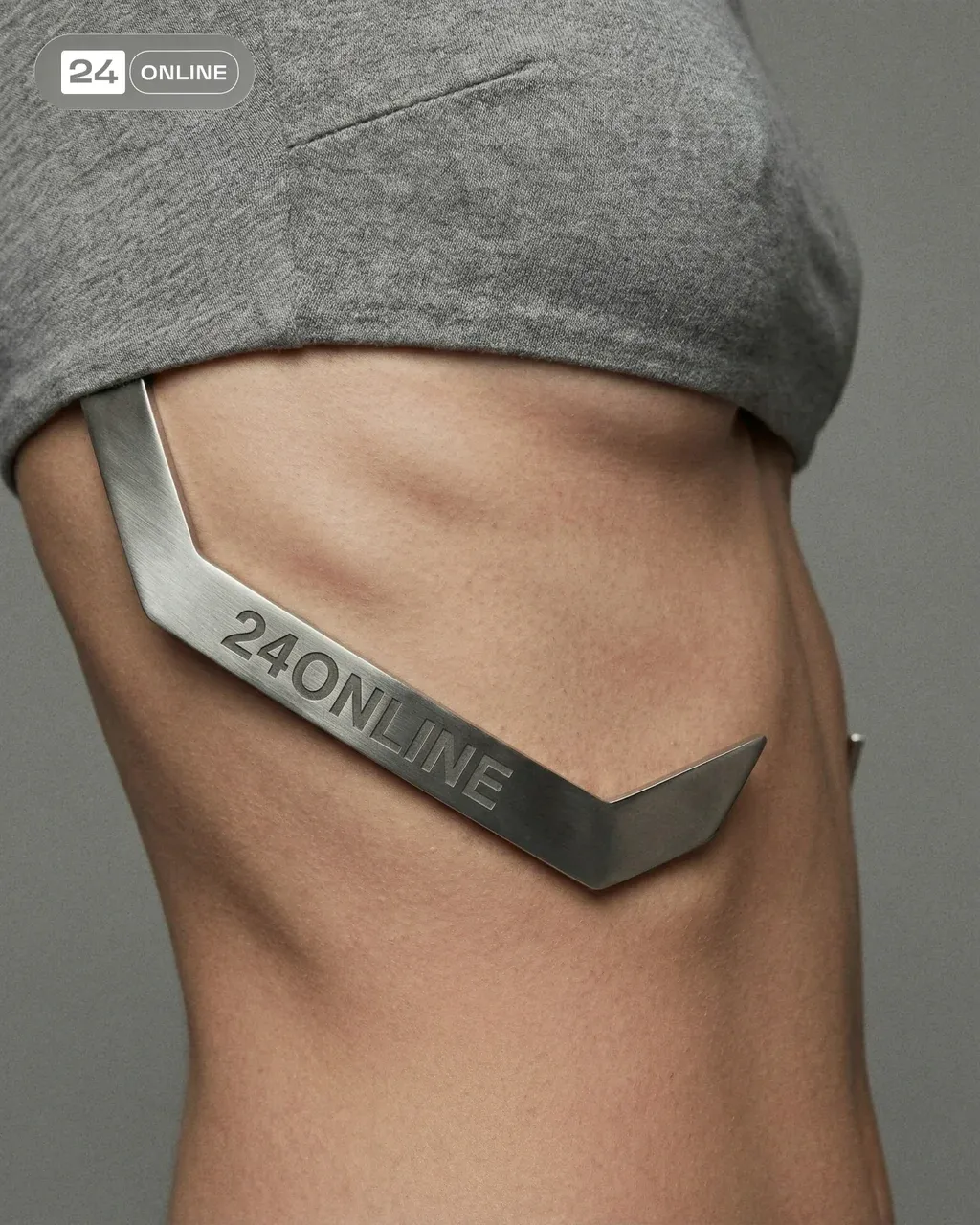 Close-up fashion photograph of a person’s waist wearing a minimalist