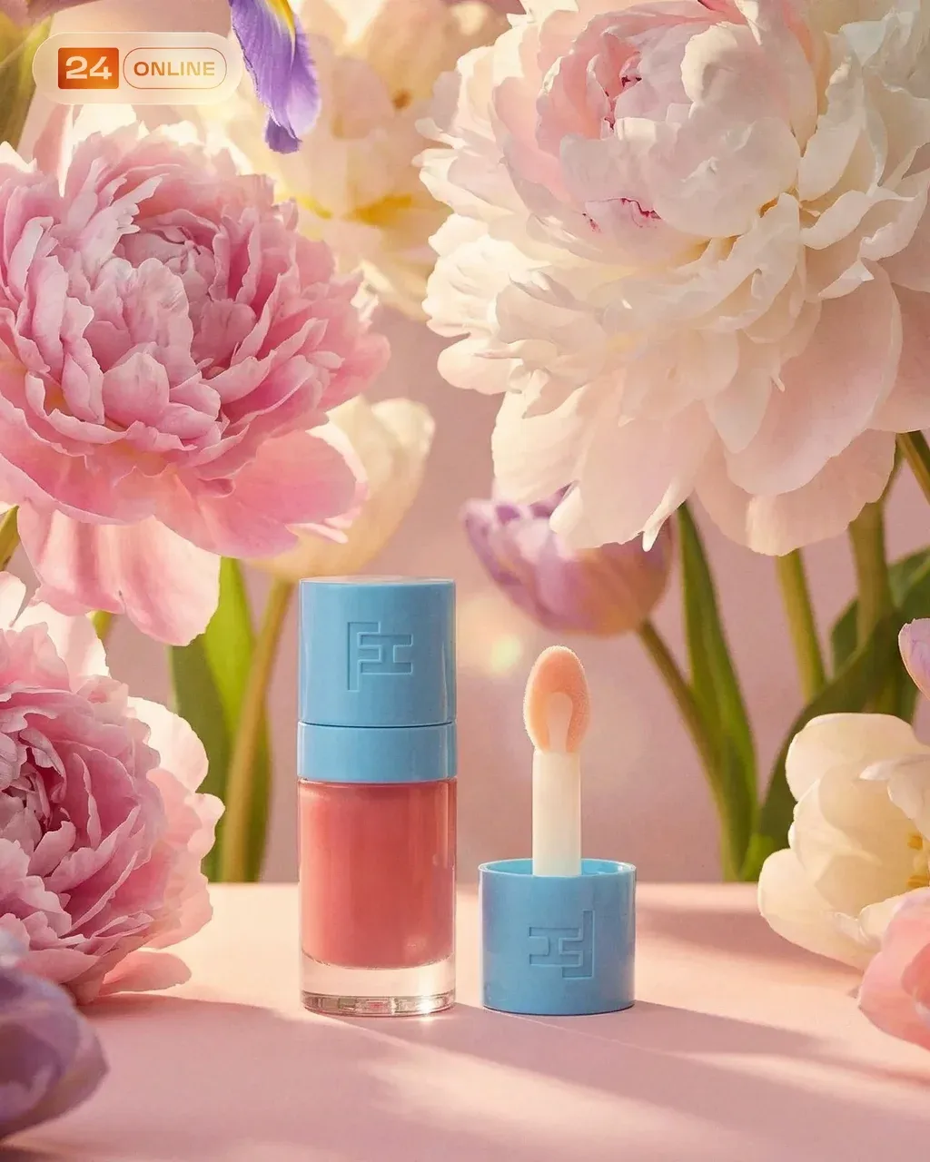 Soft glam beauty product shot of a pastel blue capped