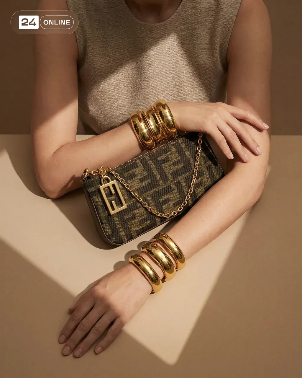 Editorial fashion still life of a brown monogram mini shoulder