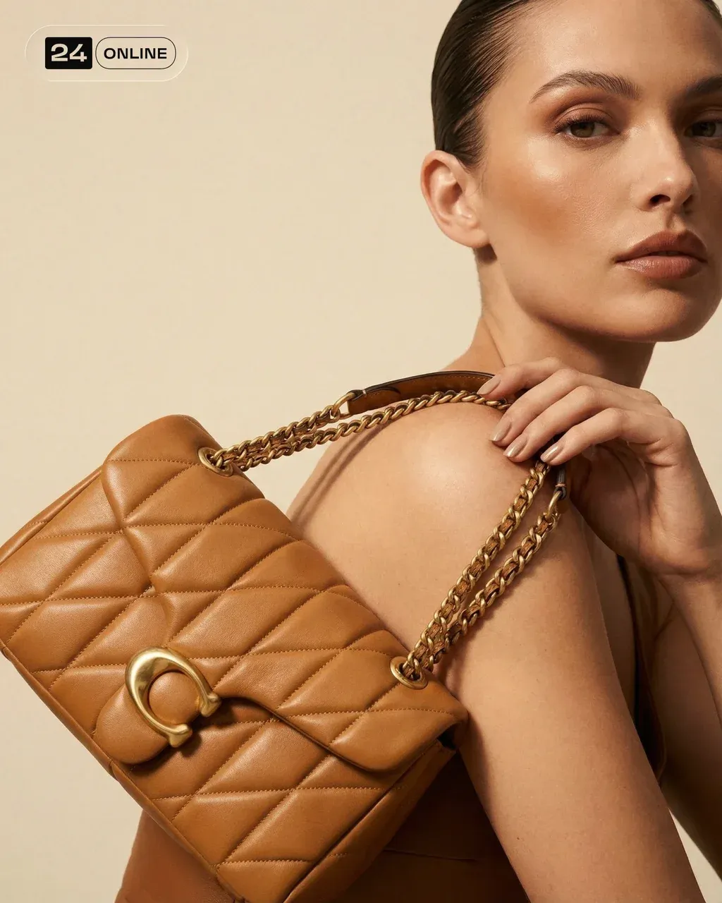 Editorial close-cropped fashion photograph of a beige and tan structured