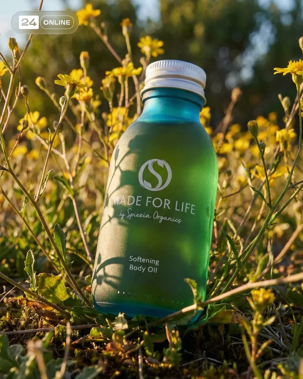 Natural outdoor product photography of a frosted emerald green glass