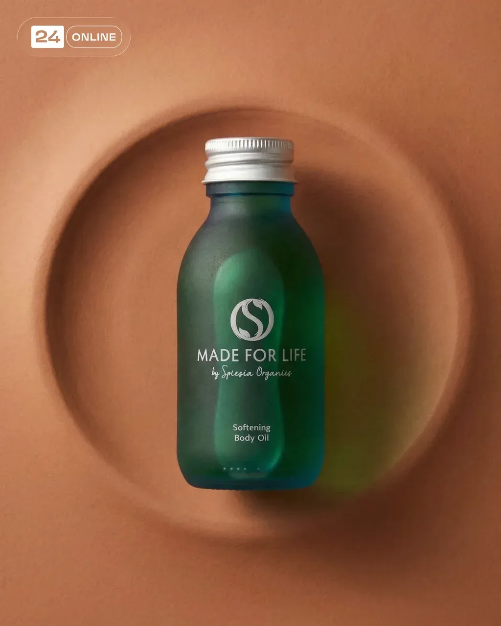 Minimalist premium product photography of a frosted emerald green glass