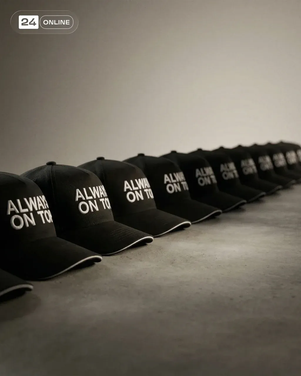 Ultra-realistic luxury campaign photograph of multiple identical red caps arrang…
