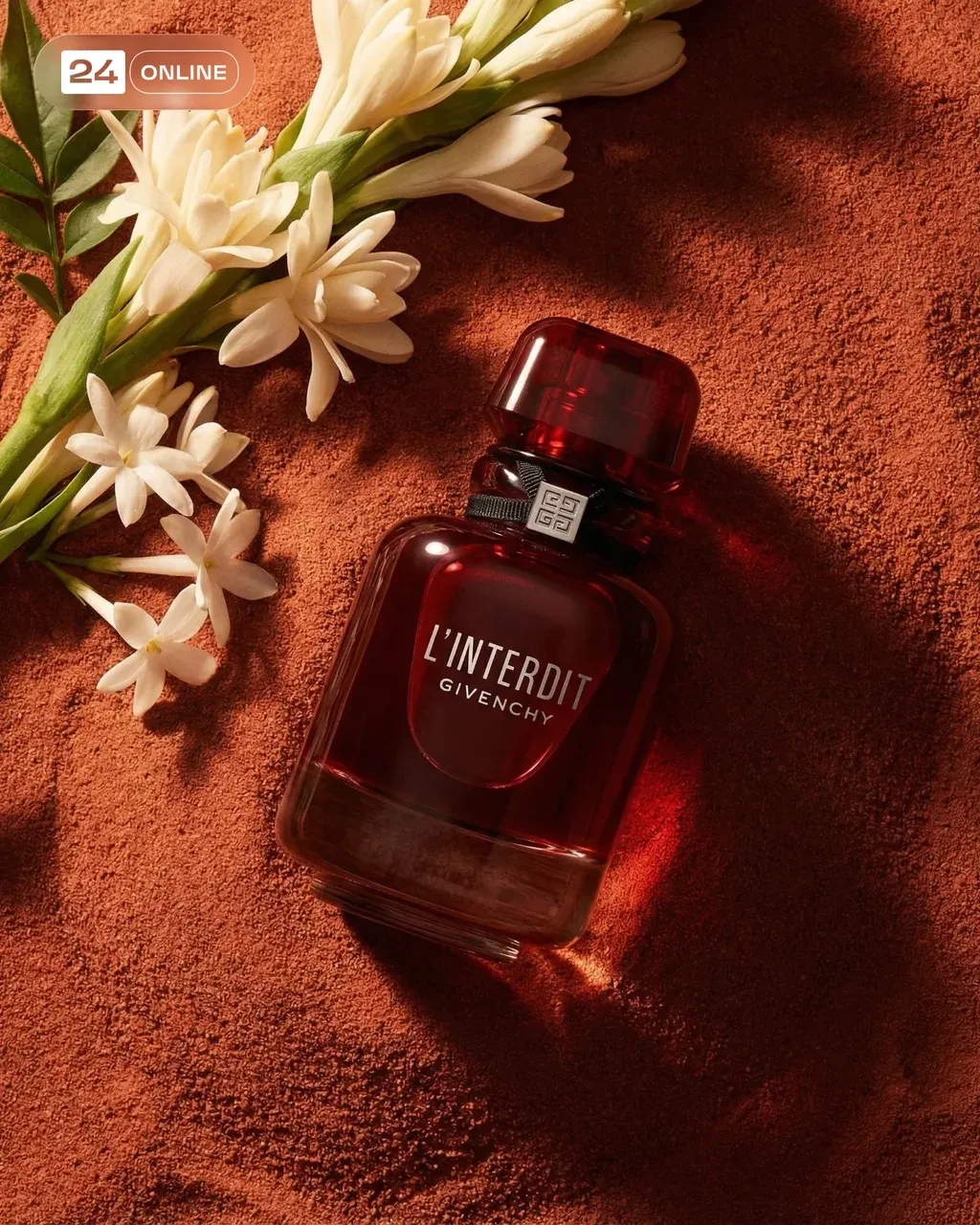Top-down cinematic product shot of a perfume bottle embedded into