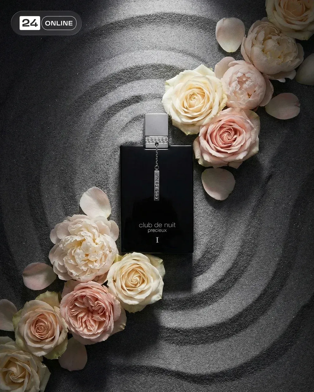 Top-down luxury still life of a transparent perfume bottle centered