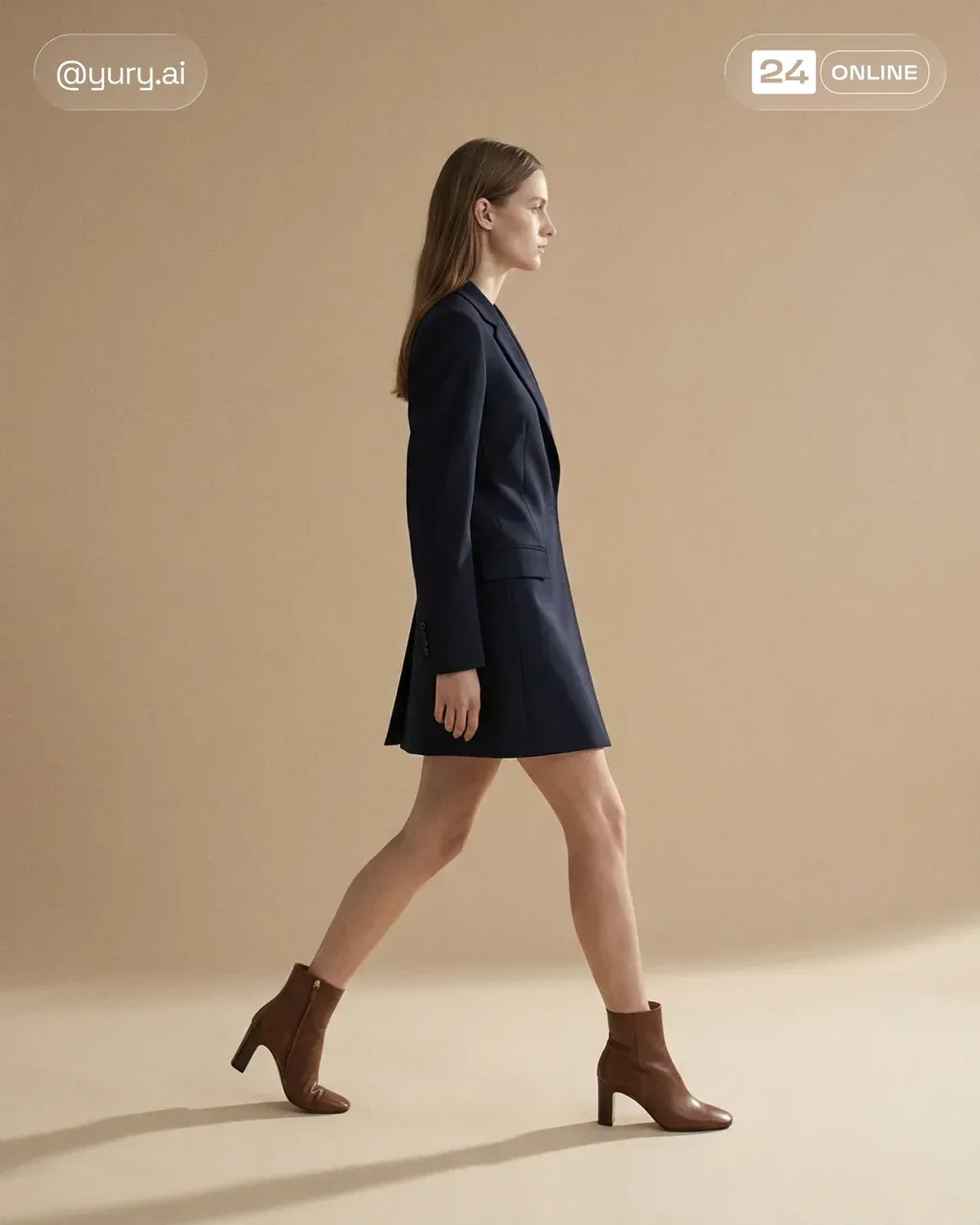Slim female model mid-stride in a navy tailored blazer dress