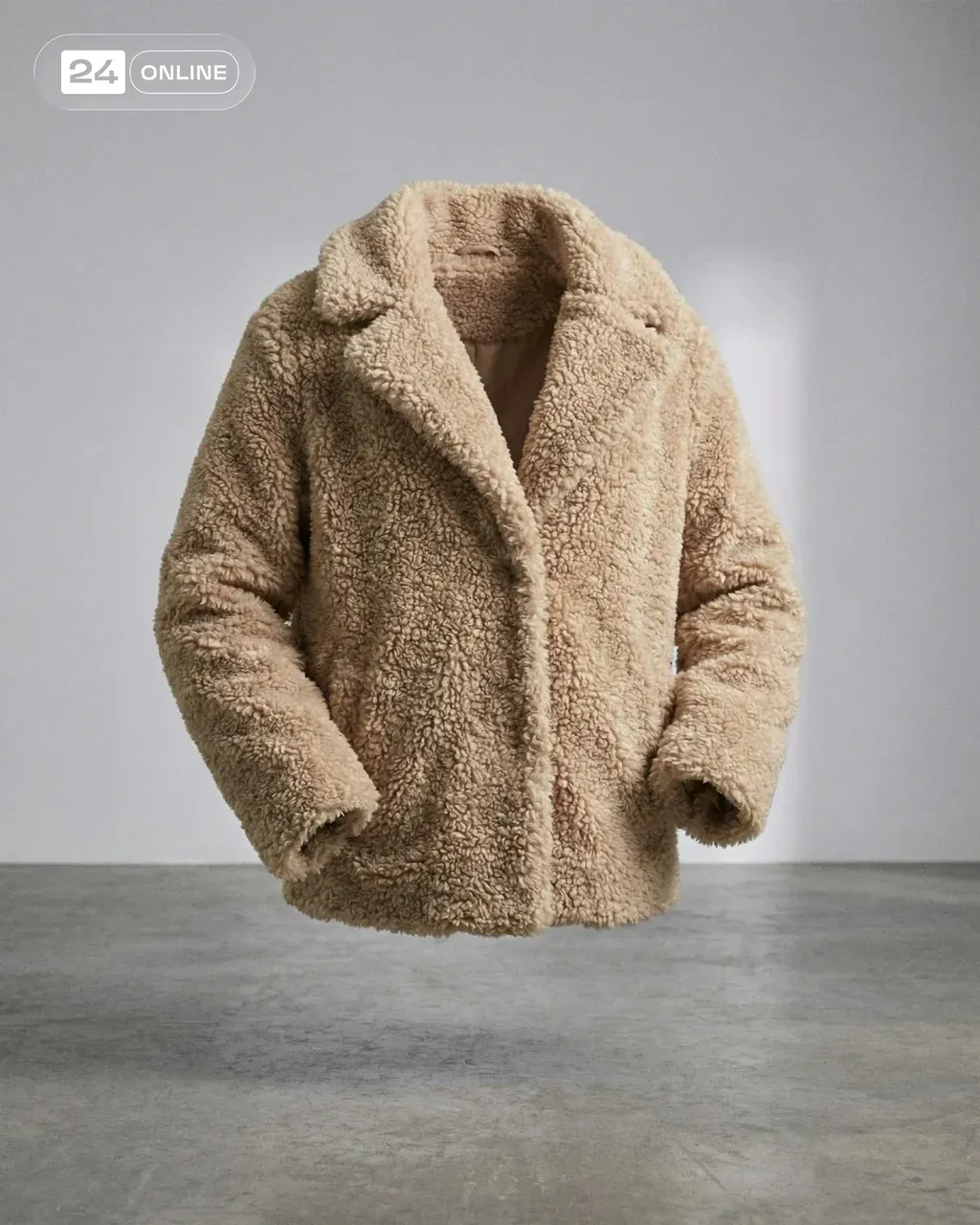 Studio product photography of the beige curly faux fur jacket