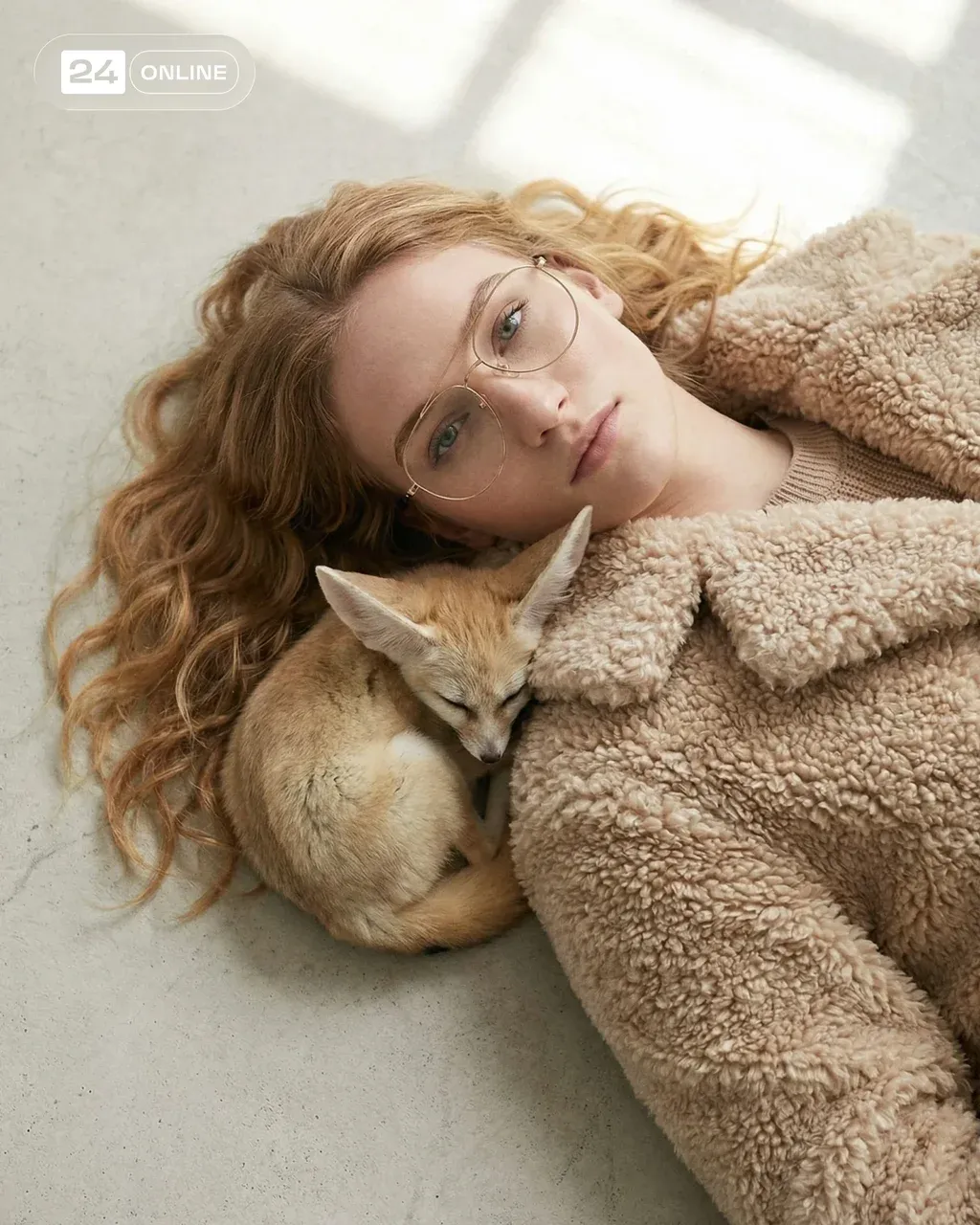 Top down view, a fashion model with shoulder-length wavy honey-blonde