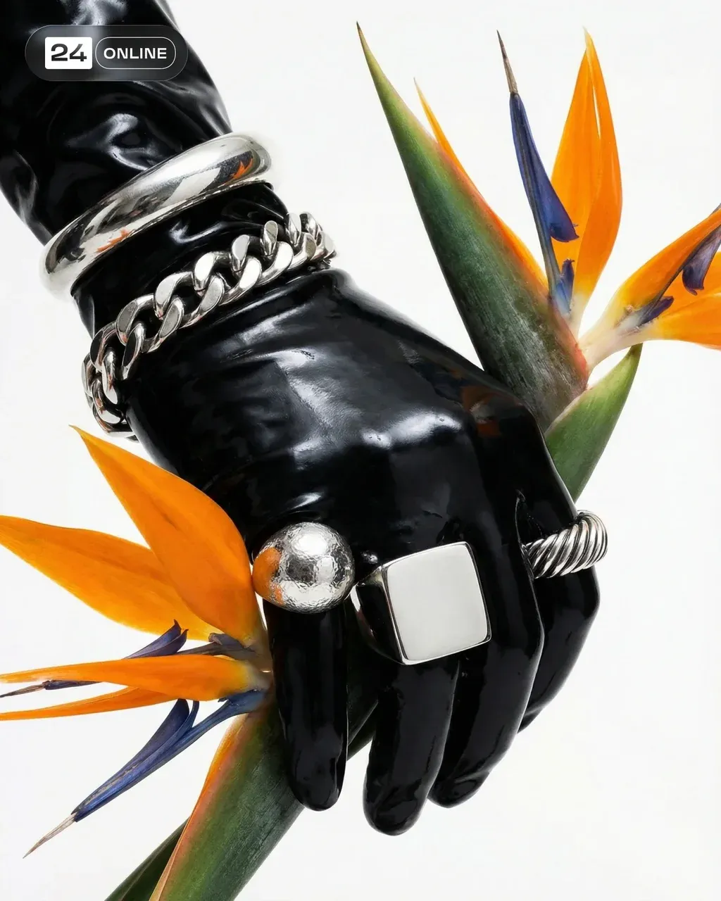 High-end editorial fashion photography, close-up macro shot. A hand wearing