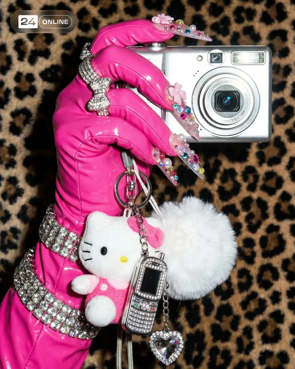 Editorial fashion photography, close-up. A hand wearing a high-gloss deep