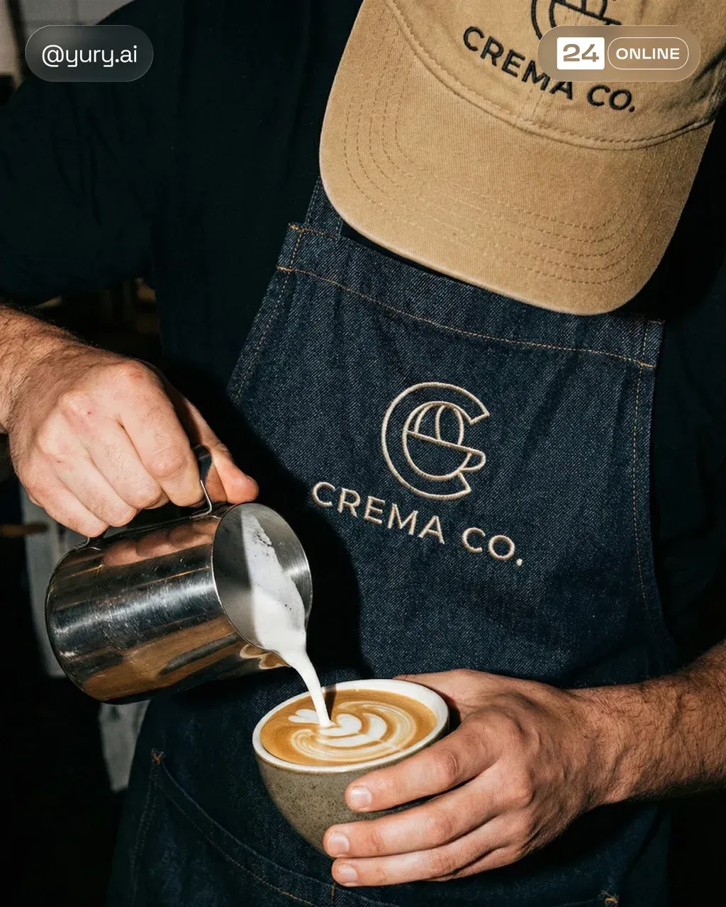 A close-up shot captures the barista pouring steamed milk into