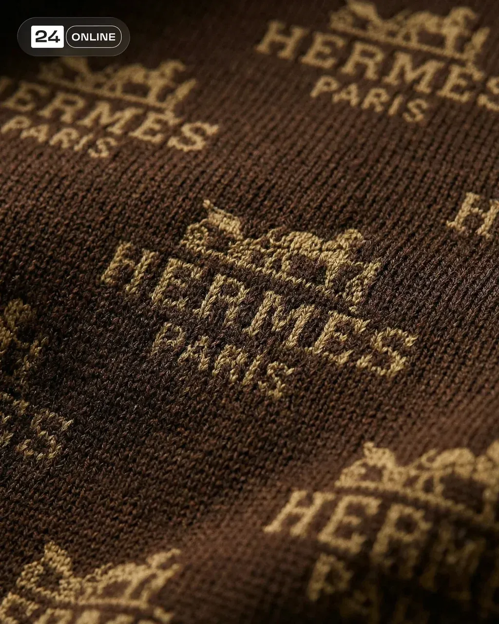 Ultra‑detailed macro photograph of repeating HERMES Paris logo pattern woven