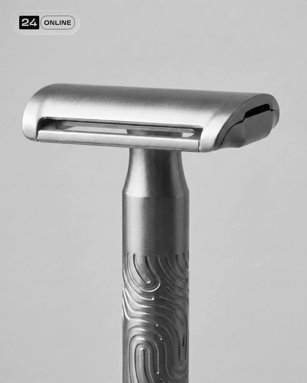A close-up photograph of a hand holding a sleek PRODUCT