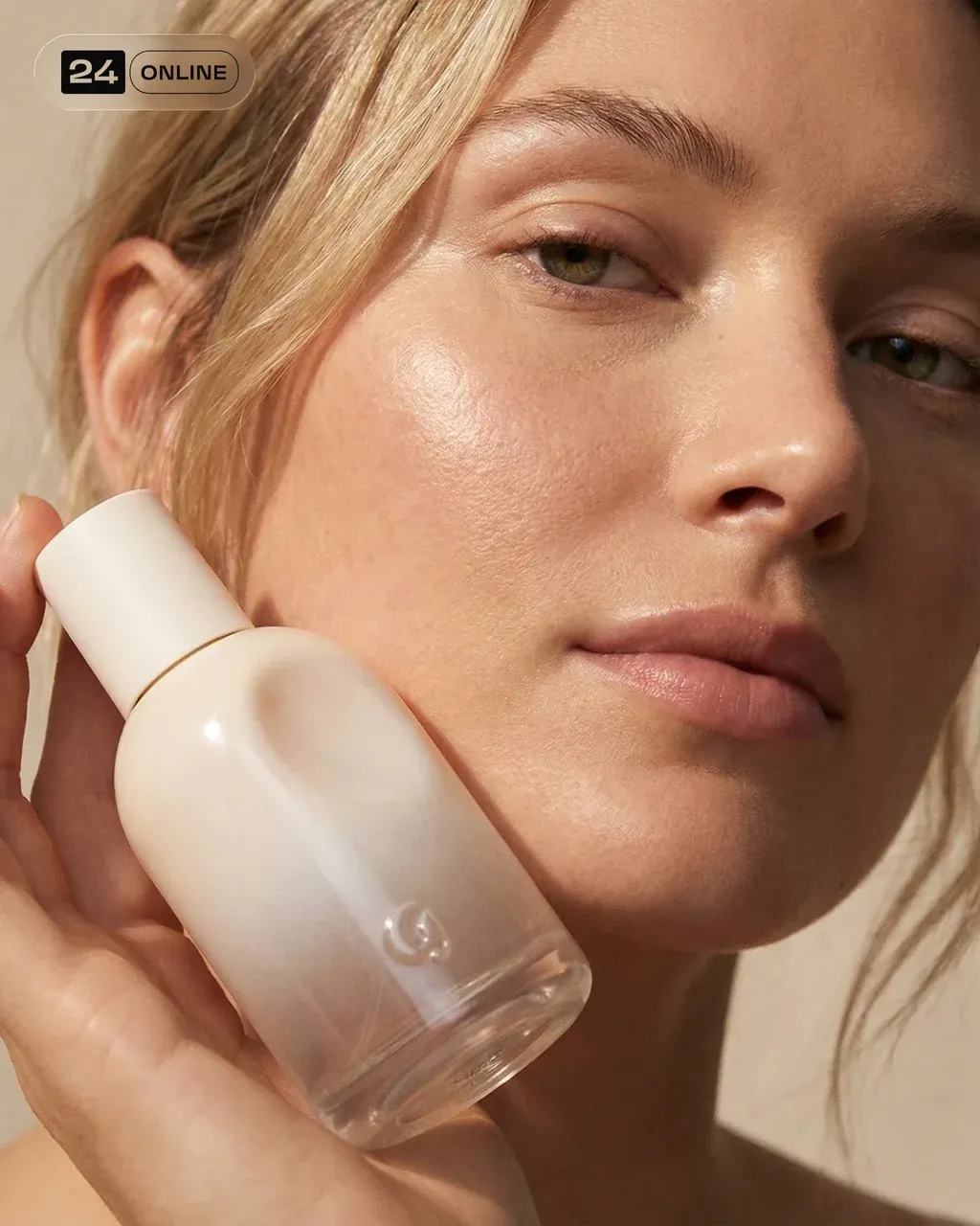 Macro close-up of a female model holding the PRODUCT perfume