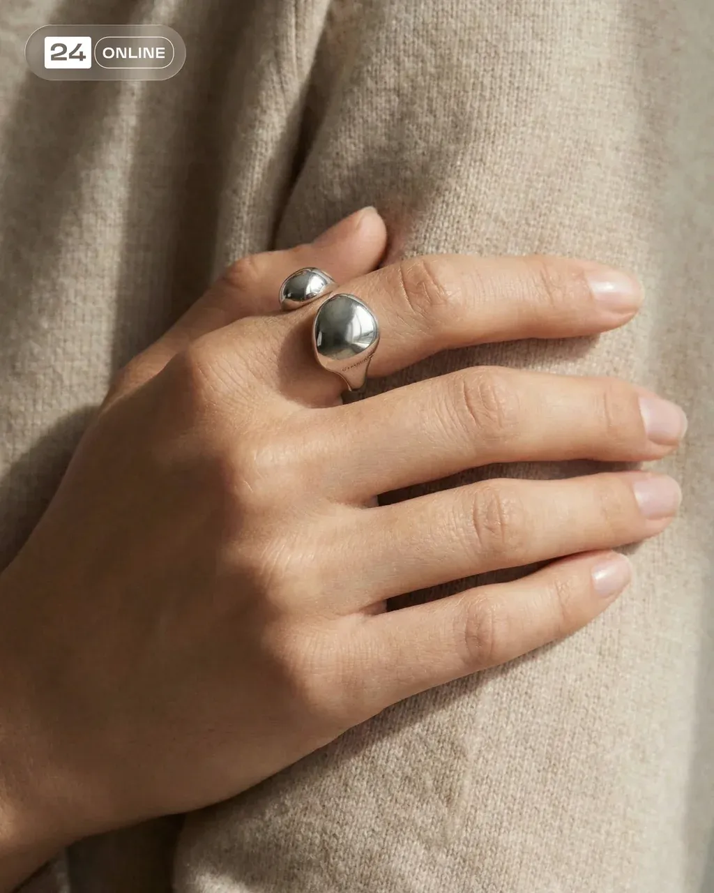 Elegant model wearing a PRODUCT , close-up of hand against