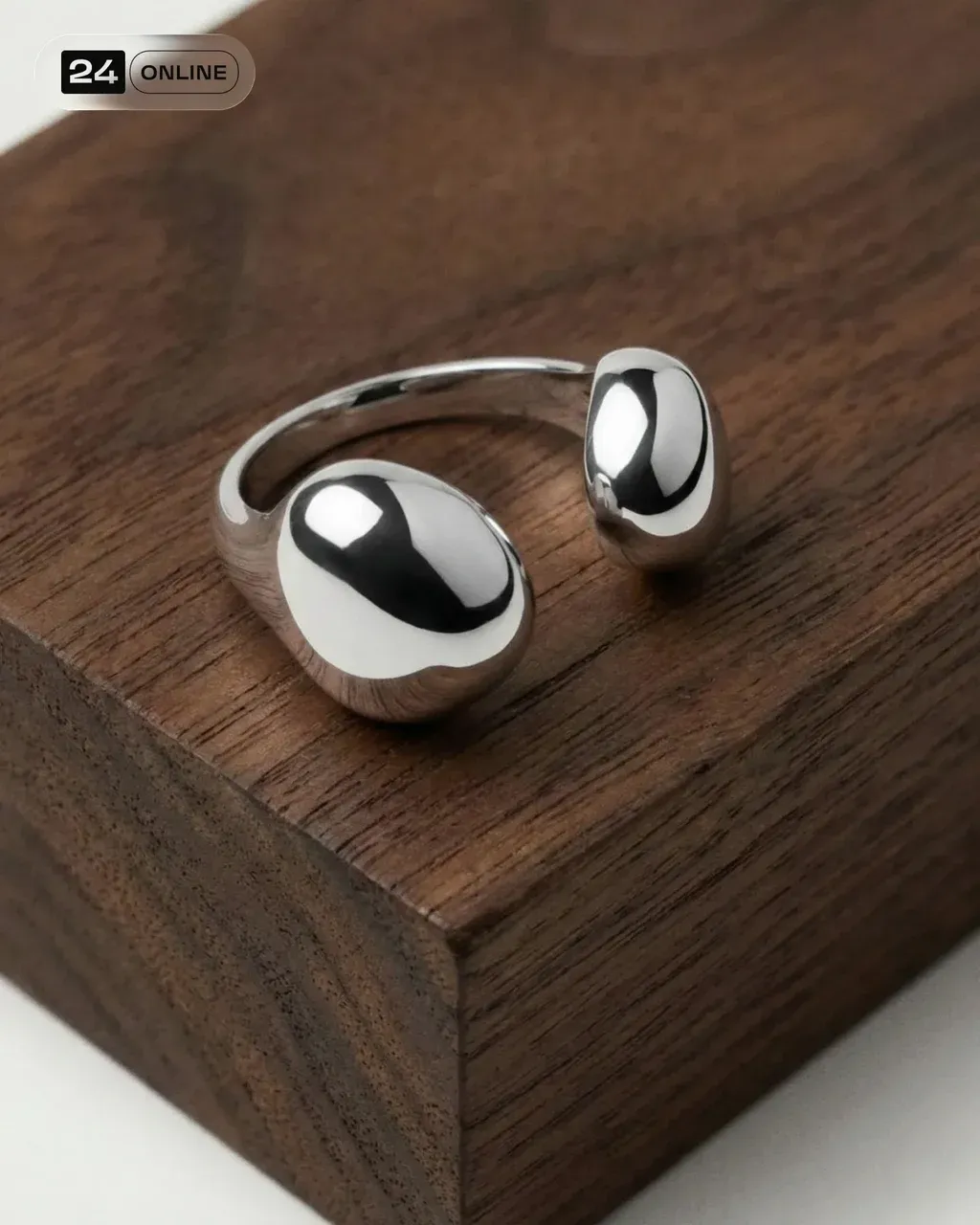 Minimalist PRODUCT , displayed on textured dark wood block, soft