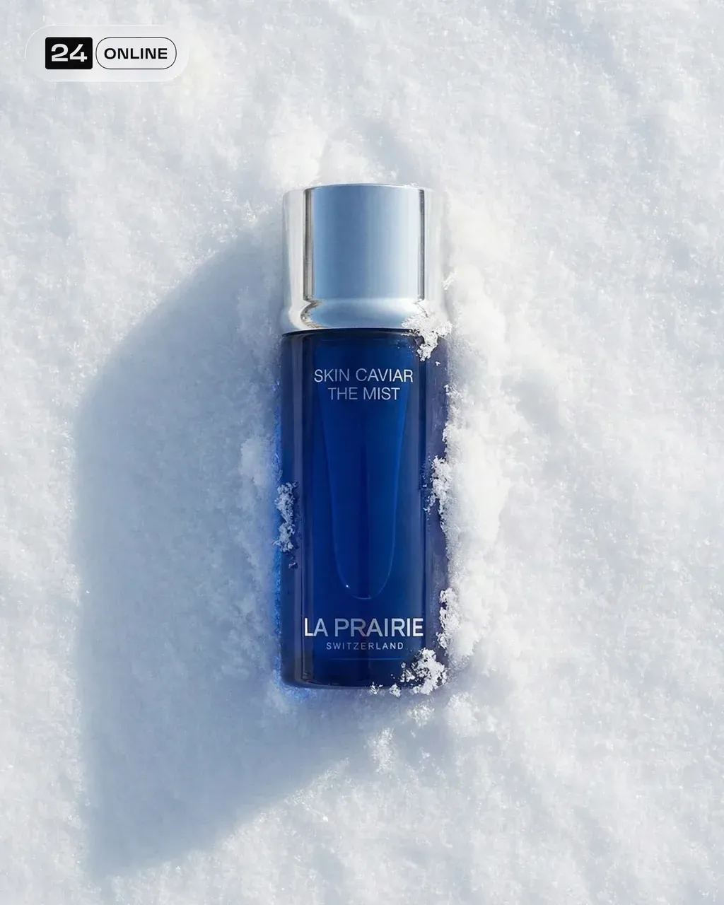 Ultra-realistic winter flat-lay shot. The PRODUCT lies horizontally, slightly pr…