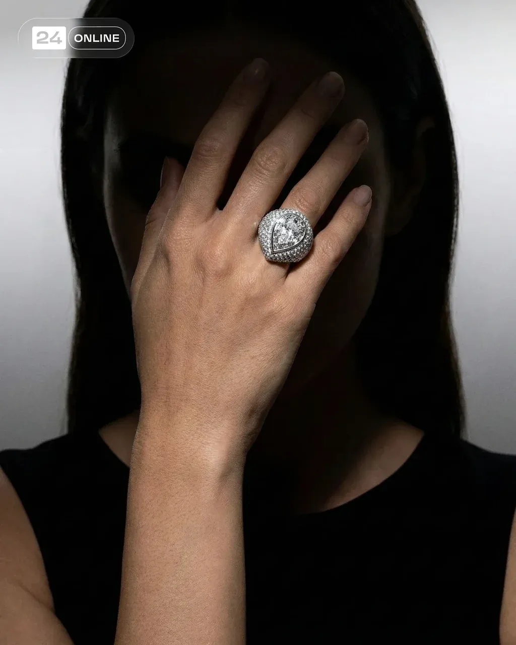 Ultra-realistic close-up of a female model covering her face with