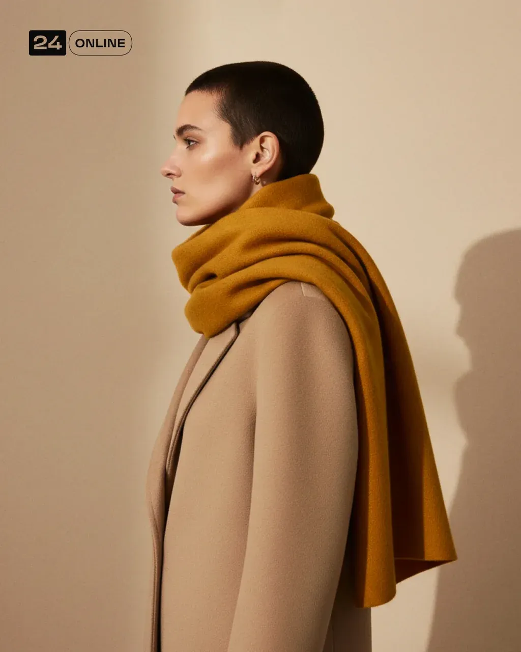 Editorial fashion portrait of a woman in side profile, wearing