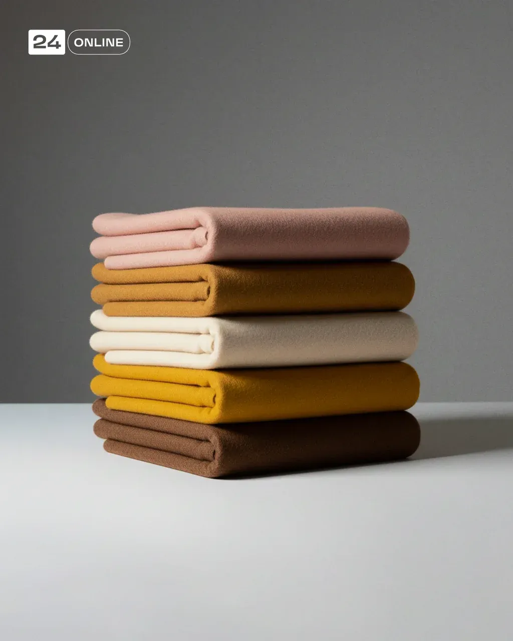 High-end editorial product photograph of a neatly stacked set of