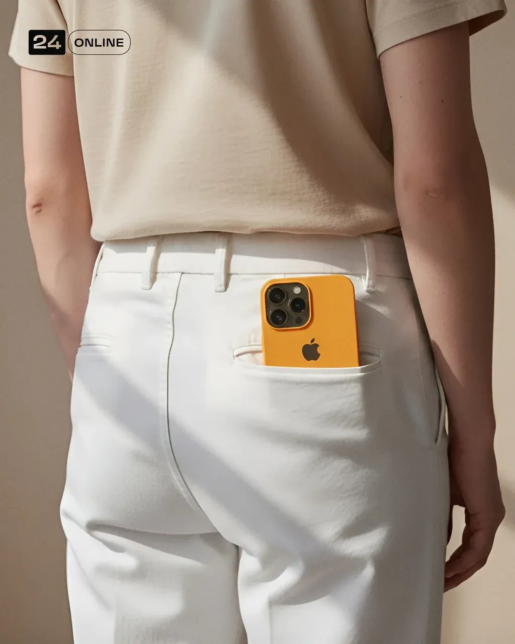 A person is shown from behind, wearing a light beige