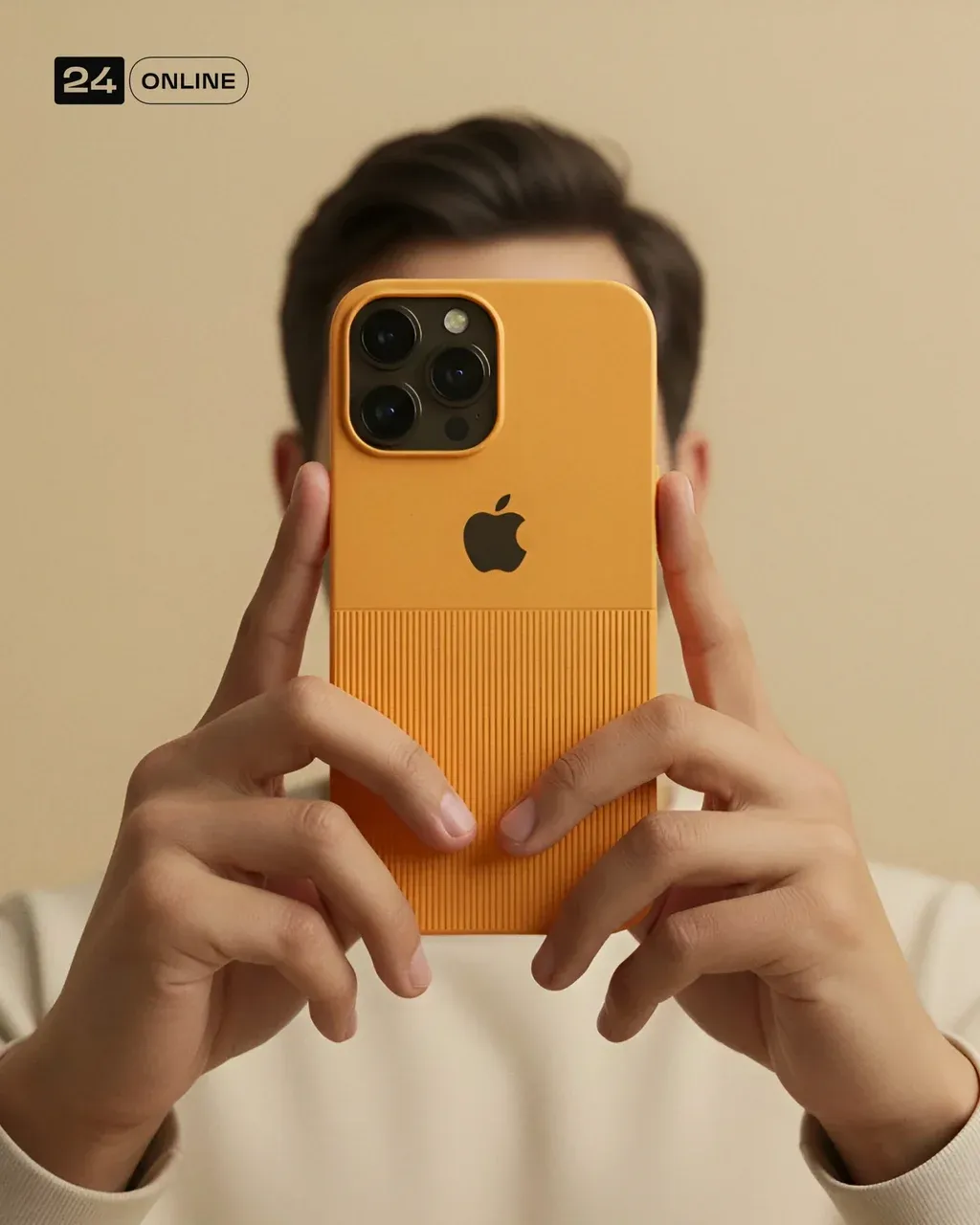 A man holds a SMARTPHONE MODEL directly in front of