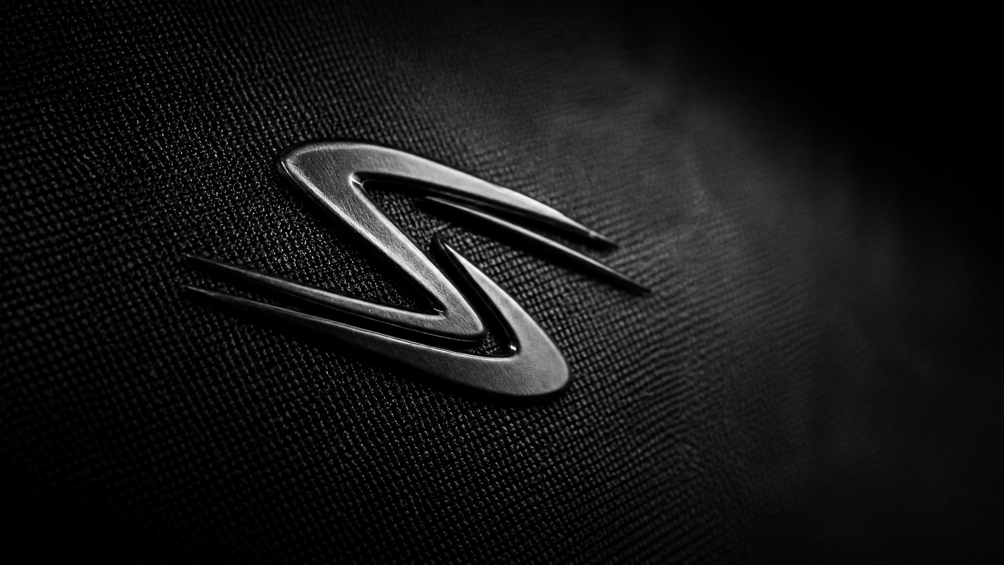Create a high-resolution cinematic macro brand image of the STRYDR logo mark. use logo fr…