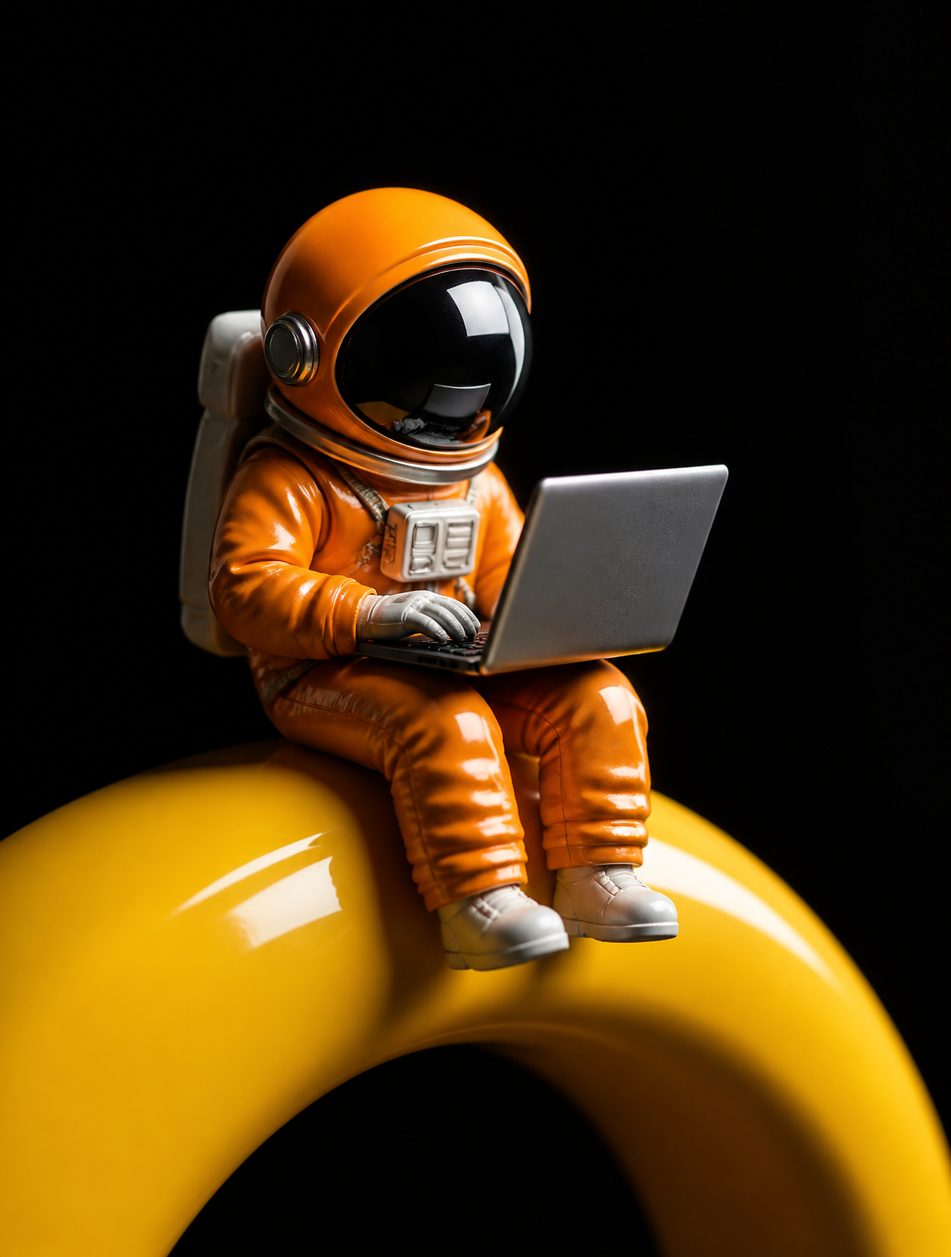 A stylized miniature astronaut in a vibrant orange pressure suit sits perched on a glossy…