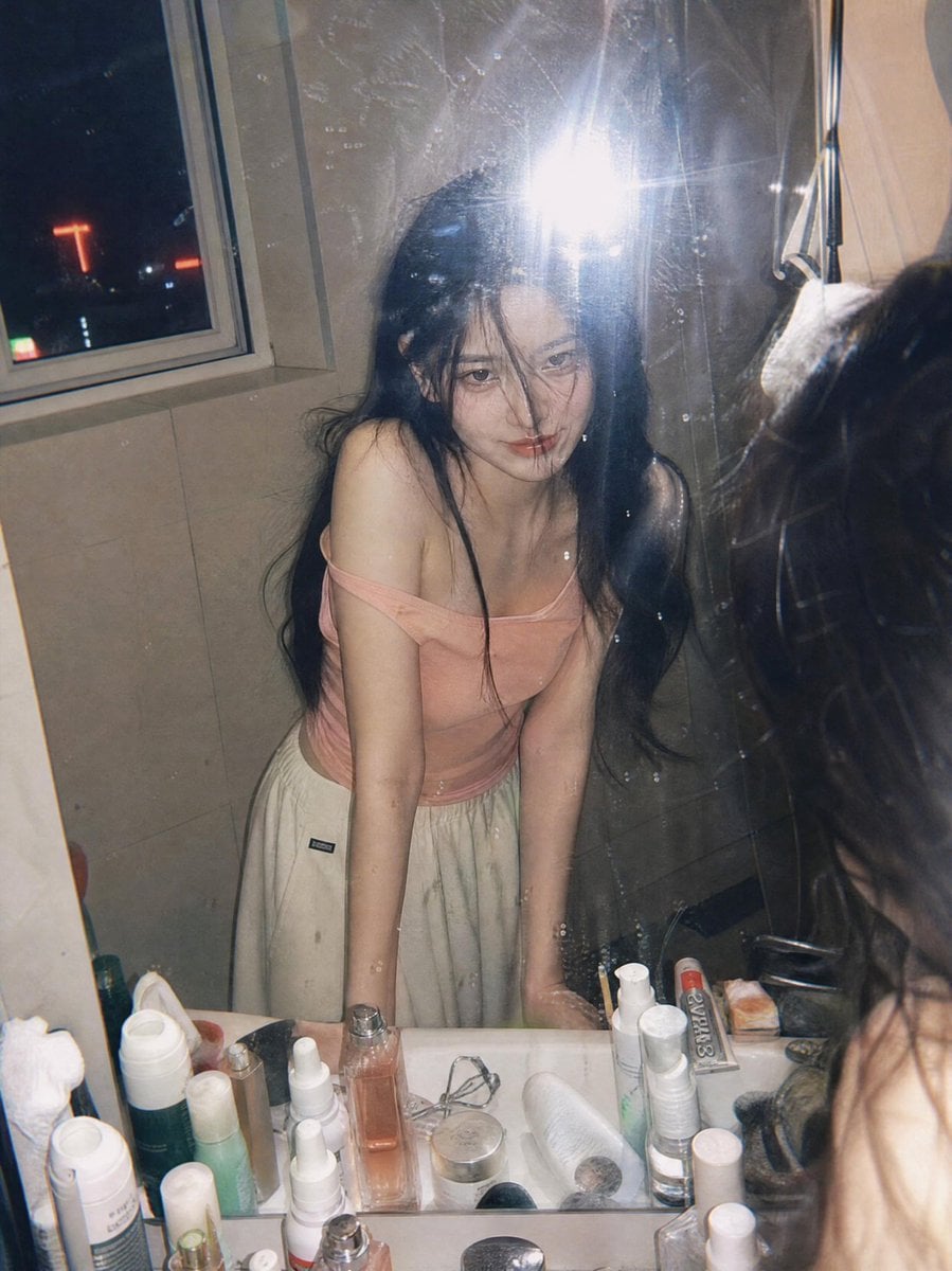 Ultra-realistic candid film photography portrait of a young woman leaning over a bathroom…