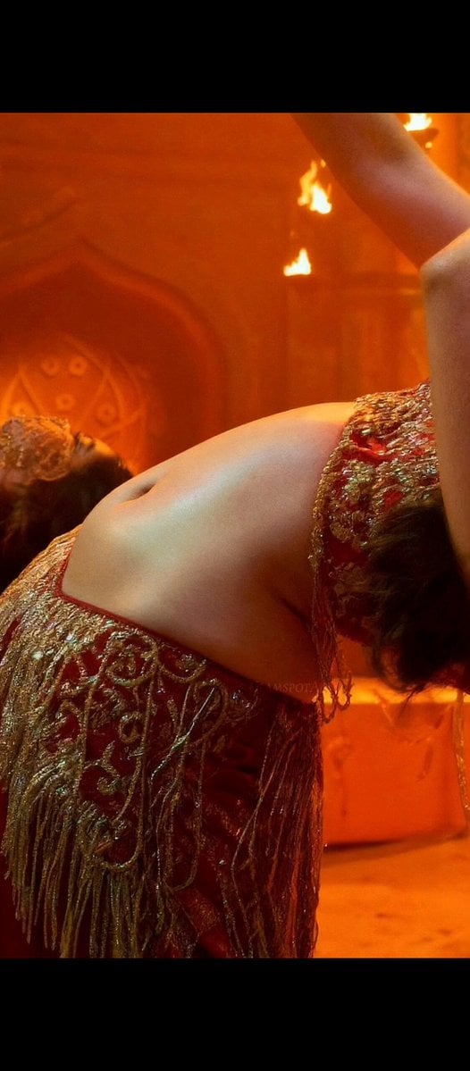 A close-up, high-fashion cinematic portrait of a beautiful South Asian woman with defined…