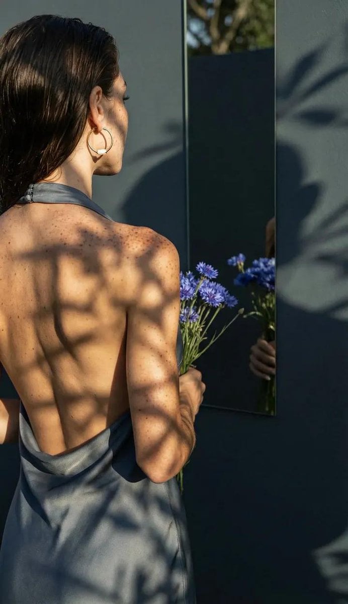 A professional, high-end photograph emphasizing the physical interplay of light and shado…